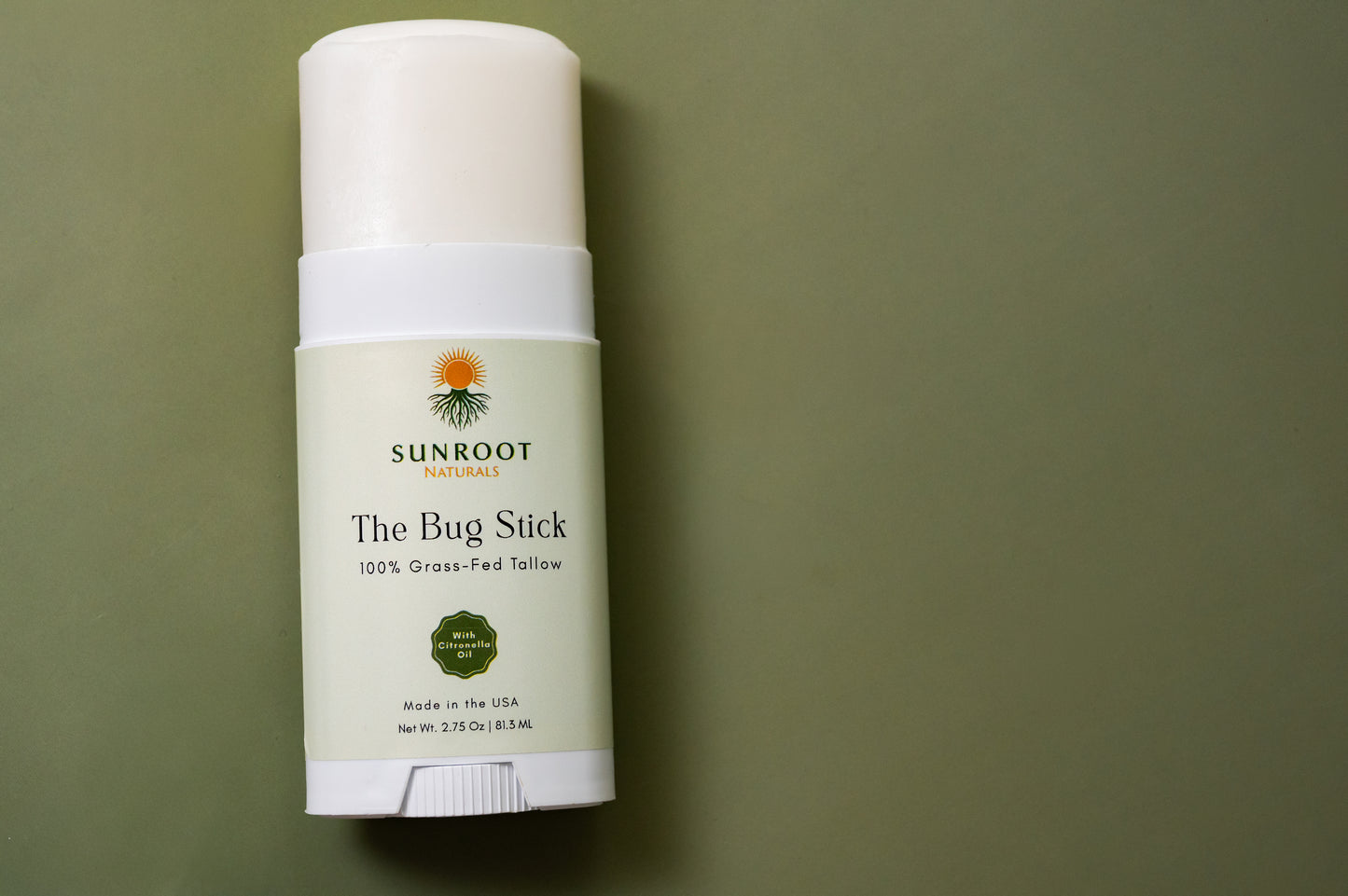 Sunroot The Bug Stick insect repellent displayed in a minimalist flat lay arrangement.