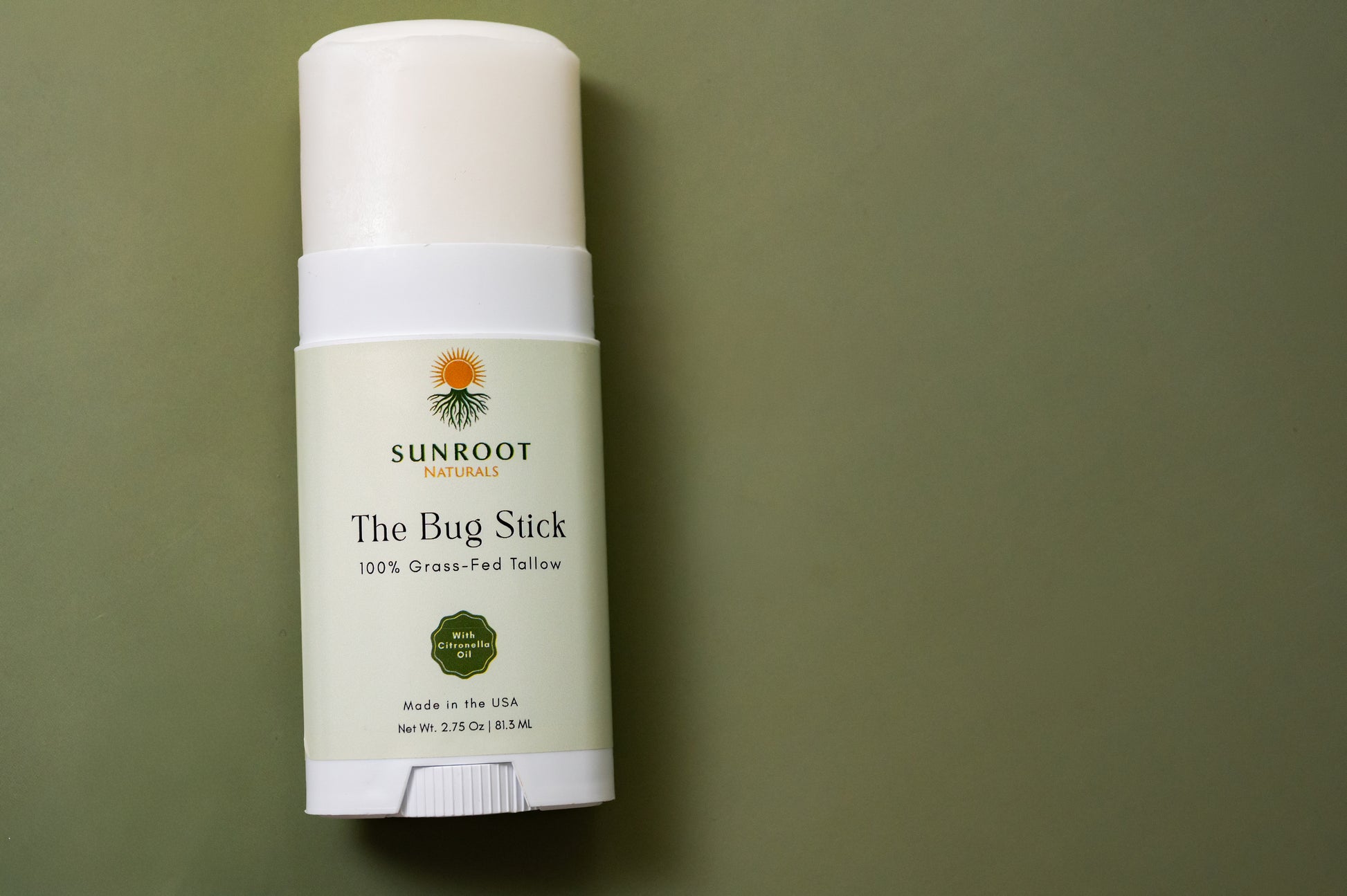 Sunroot The Bug Stick insect repellent displayed in a minimalist flat lay arrangement.